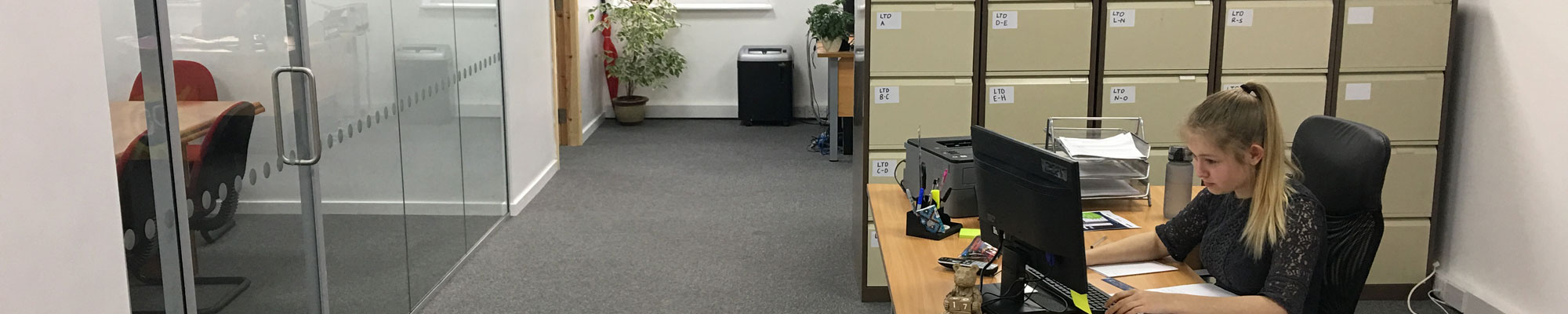 Reception desk and meeting room at Bruce Roberts & Co in Wrexham