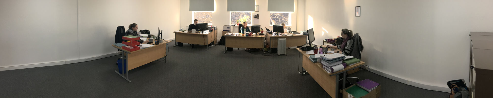 Panoramic view of accountants working in office at Bruce Roberts & Co in Wrexham