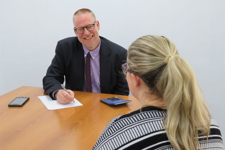 Bruce Roberts advising a business client in Wrexham