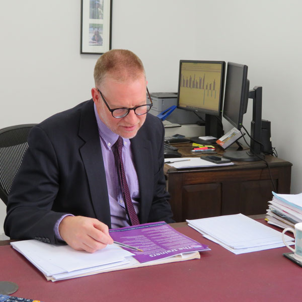 Accountant looking over business accounts in Wrexham